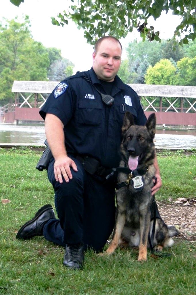 Respectable police officer and dog. 